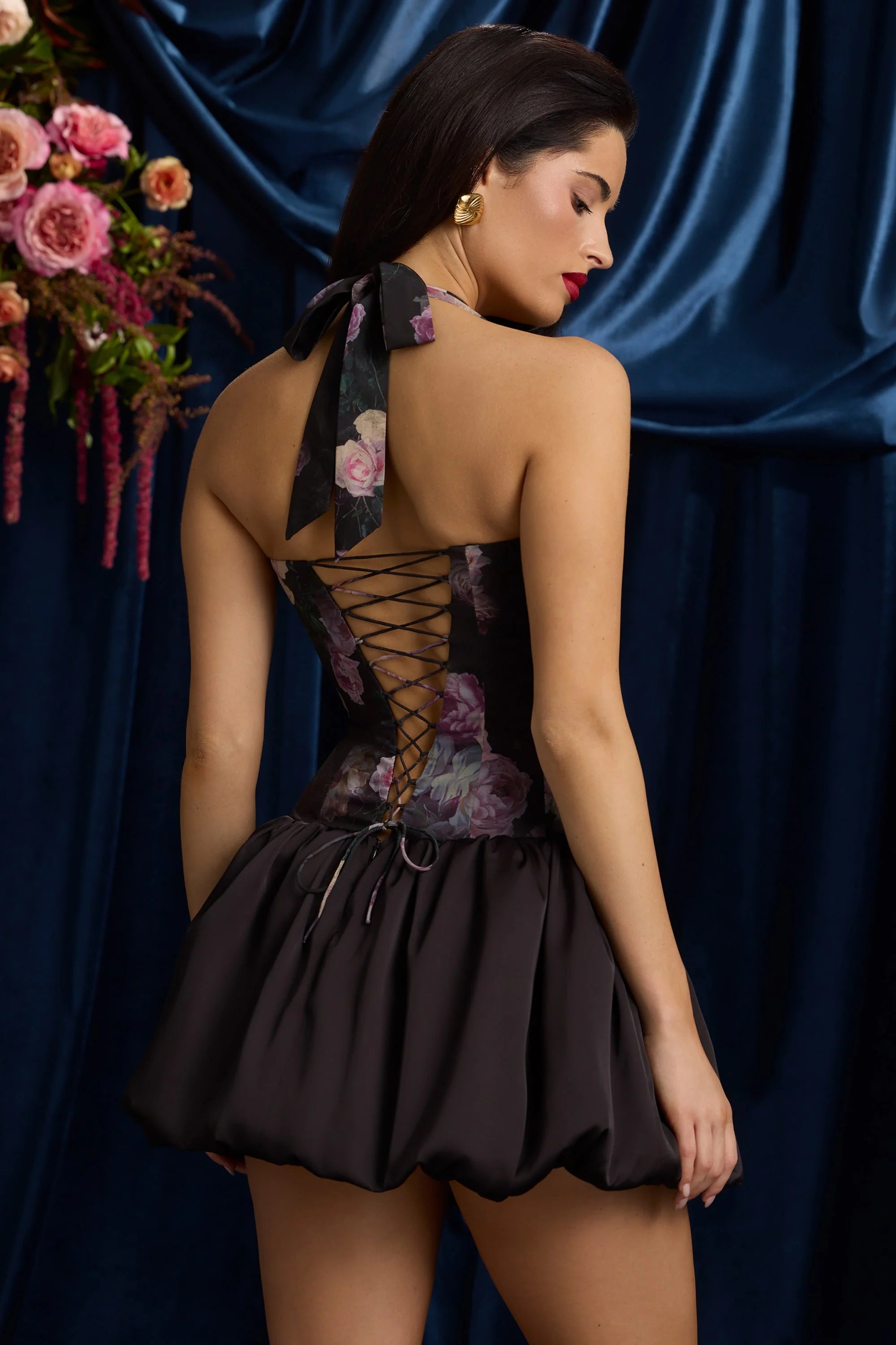 Halterneck Lace Up Bubble Hem Mini Dress in Black Floral Print