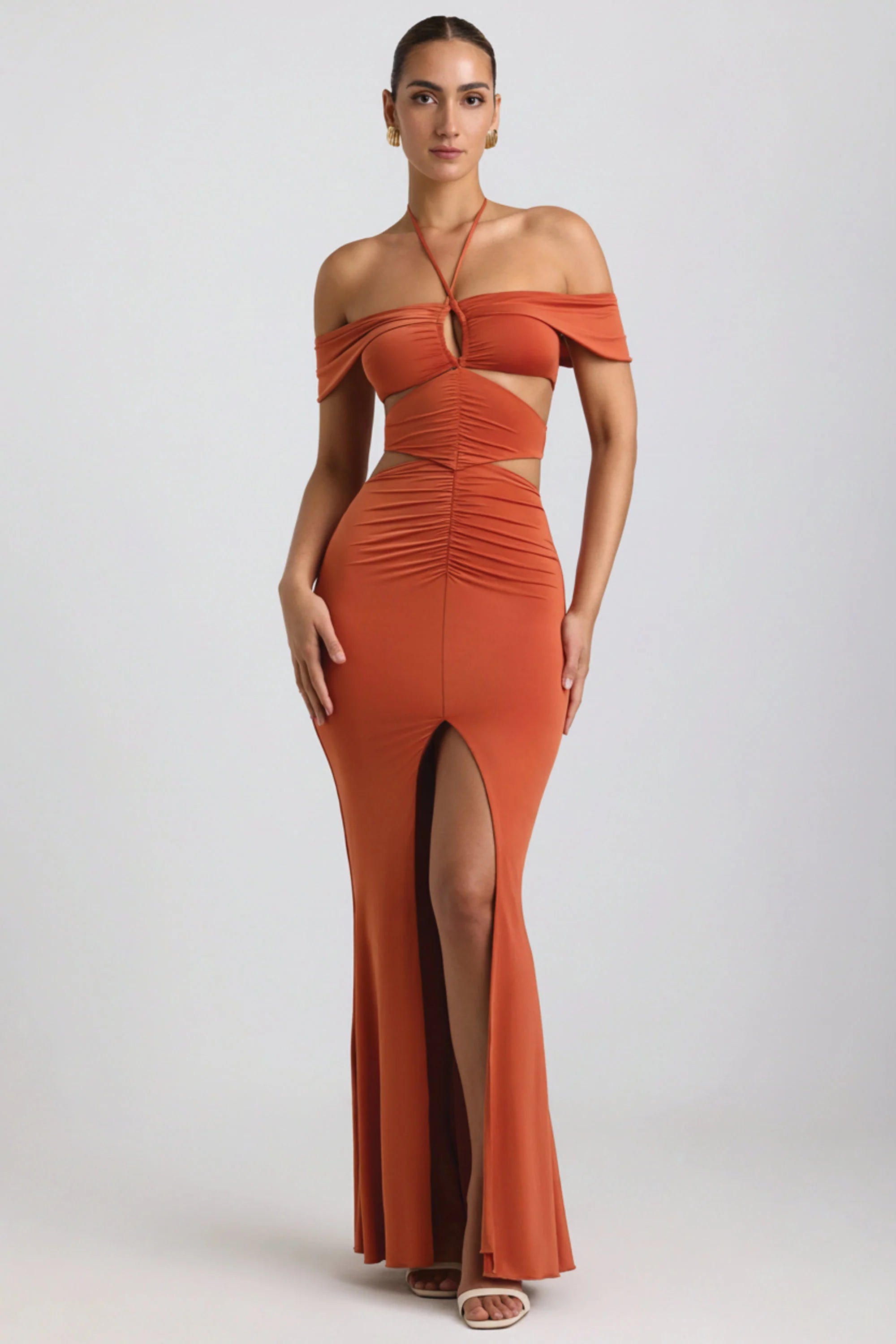 Slinky Jersey Cut Out Halterneck Gown in Burnt Orange