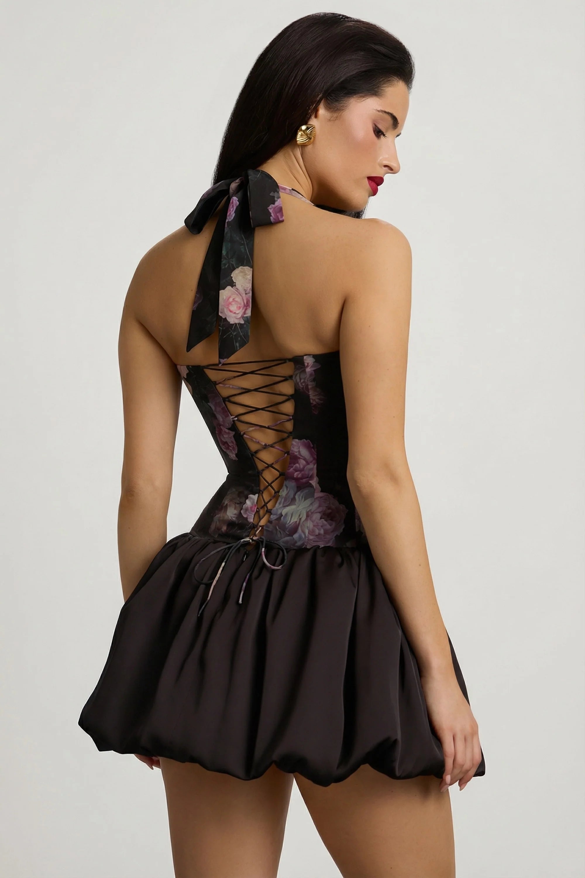 Halterneck Lace Up Bubble Hem Mini Dress in Black Floral Print