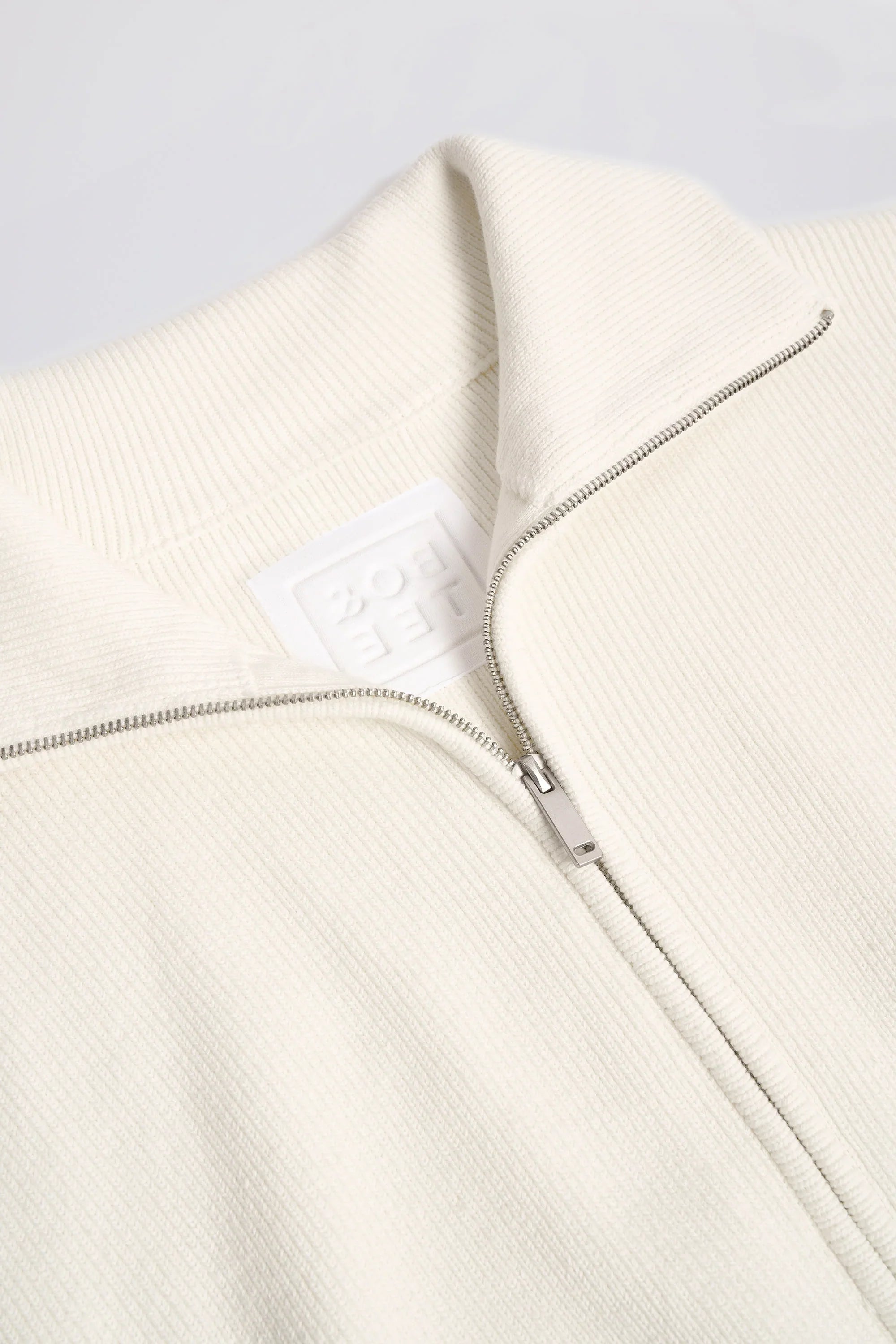 Ribbed Knit Zip Up Cropped Sweatshirt in Ivory